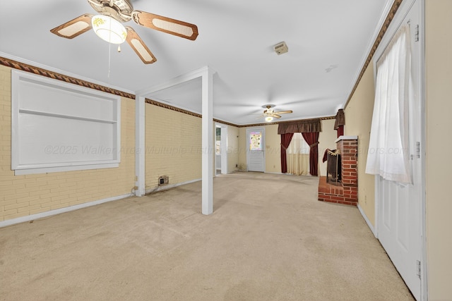 3209 Elm St, Adamsville, AL 35005 - carpeted empty room featuring a ceiling fan and brick wall