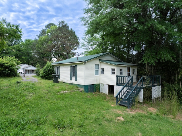 2701 Preston Ave, Jasper, AL 35501 - back of house featuring a deck, stairway, and a yard