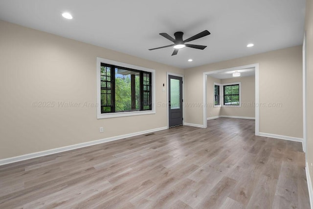 spare room with recessed lighting, wood finished floors, visible vents, baseboards, and ceiling fan