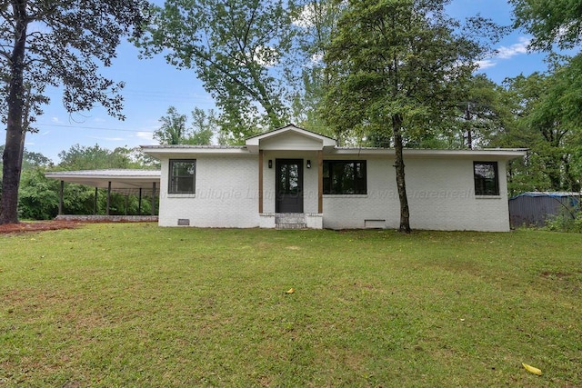 single story home featuring a front lawn, brick siding, and a carport