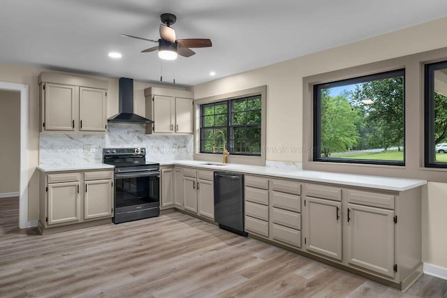 kitchen with dishwasher, electric stove, a ceiling fan, a sink, and wall chimney exhaust hood