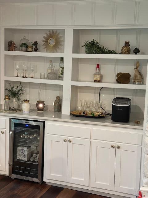 3111 18th Ave, Haleyville, AL 35565 - indoor dry bar featuring beverage cooler and dark wood-style floors
