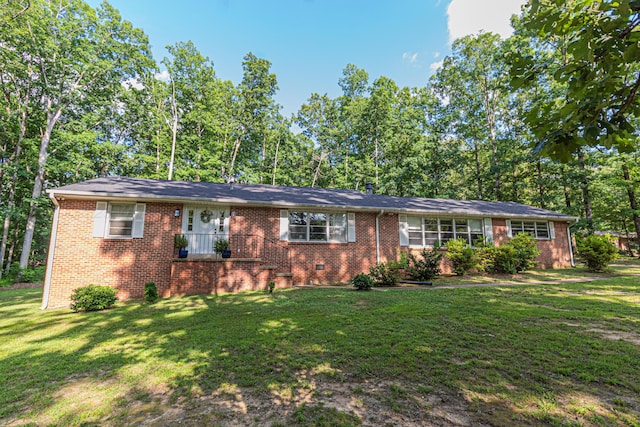 3111 18th Ave, Haleyville, AL 35565 - single story home with a front lawn, brick siding, and view of wooded area