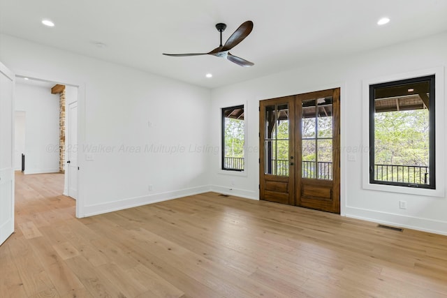 empty room featuring a ceiling fan, recessed lighting, baseboards, and light wood-type flooring