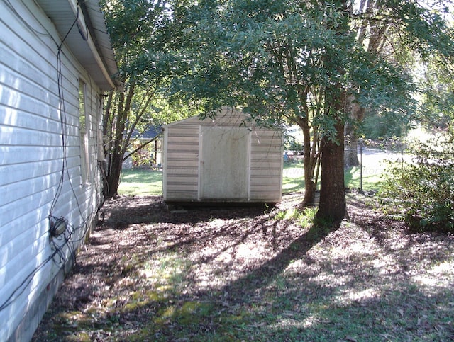 2665 Holly Rd, Jasper, AL 35501 - view of yard with an outbuilding, a storage unit, and fence
