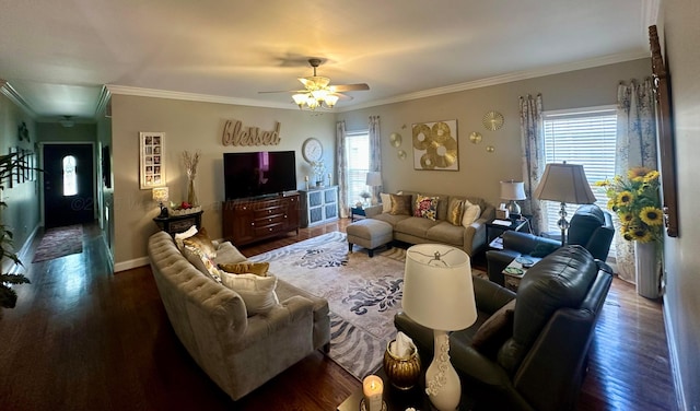living area with wood finished floors, ceiling fan, crown molding, and baseboards