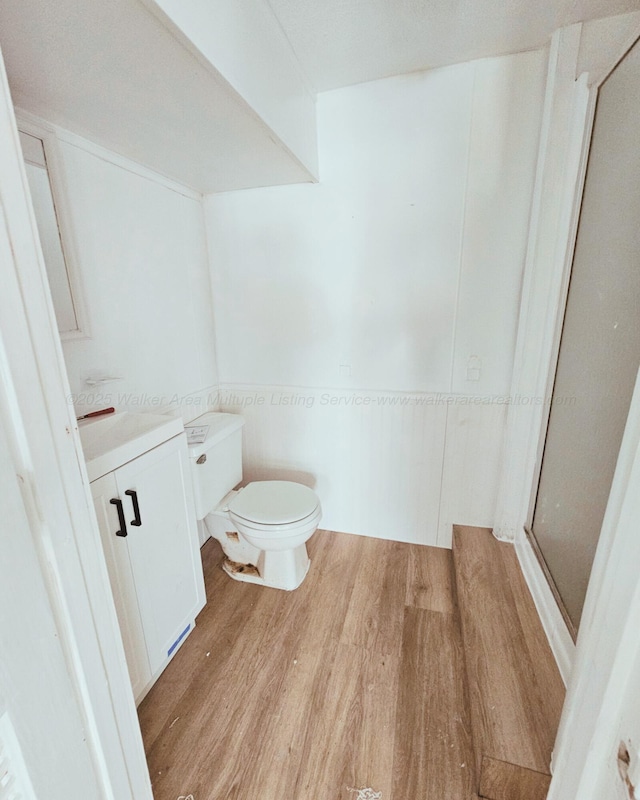 1332 4th Way, Birmingham, AL 35215 - full bath with wood finished floors, toilet, vanity, and a shower stall
