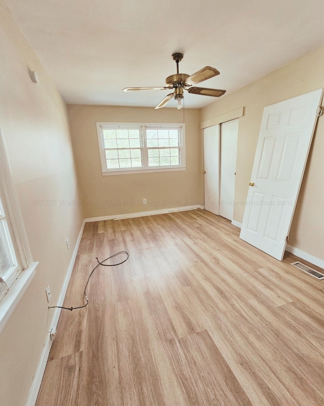 1332 4th Way, Birmingham, AL 35215 - unfurnished bedroom with wood finished floors, baseboards, a closet, and a ceiling fan