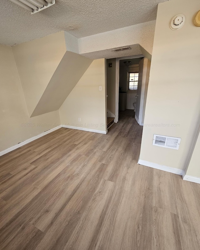1332 4th Way, Birmingham, AL 35215 - bonus room with a textured ceiling, wood finished floors, and baseboards