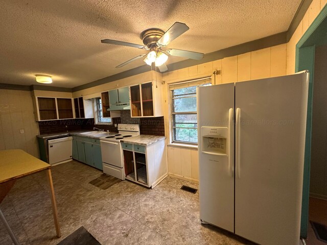 47 Hyche Rd, Cordova, AL 35550 - kitchen with white appliances, under cabinet range hood, open shelves, a textured ceiling, and a ceiling fan