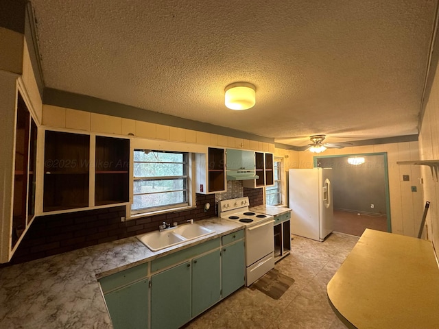 47 Hyche Rd, Cordova, AL 35550 - kitchen with white appliances, green cabinets, a sink, open shelves, and under cabinet range hood