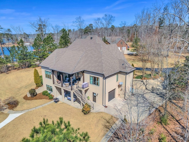 930 County Road 175, Crane Hill, AL 35053 - back of property featuring driveway, a patio area, stairway, stucco siding, and a garage