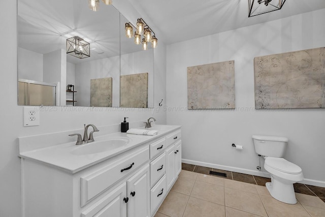 bathroom featuring toilet, tile patterned flooring, a sink, and visible vents