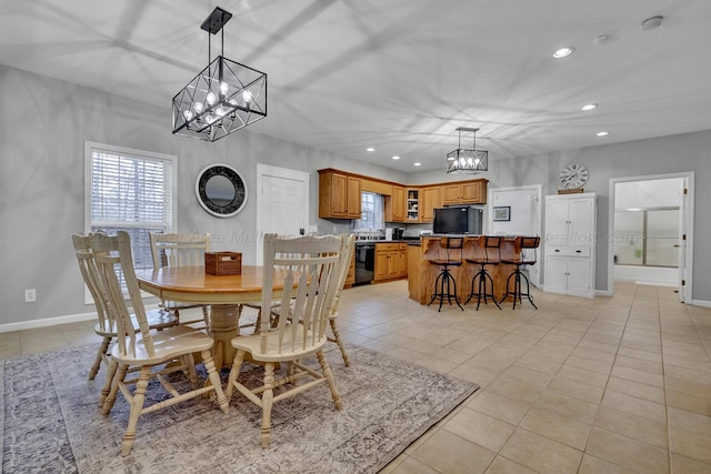 dining area featuring light tile patterned floors, recessed lighting, a chandelier, and baseboards