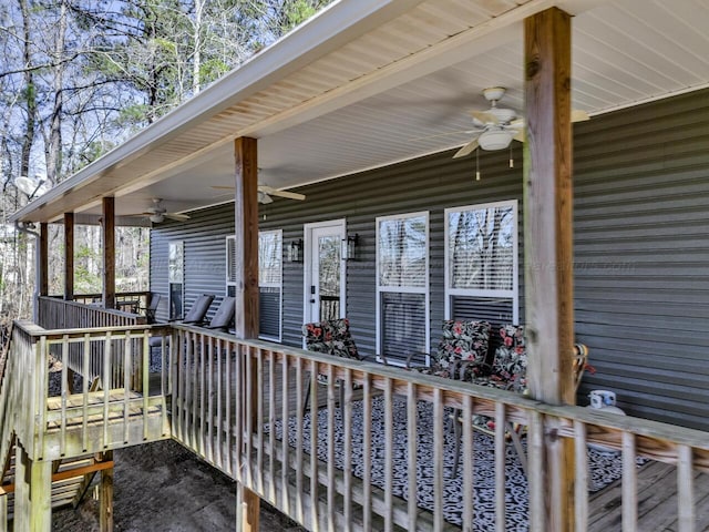 wooden deck featuring ceiling fan