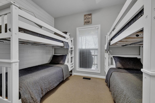 bedroom with carpet flooring and baseboards