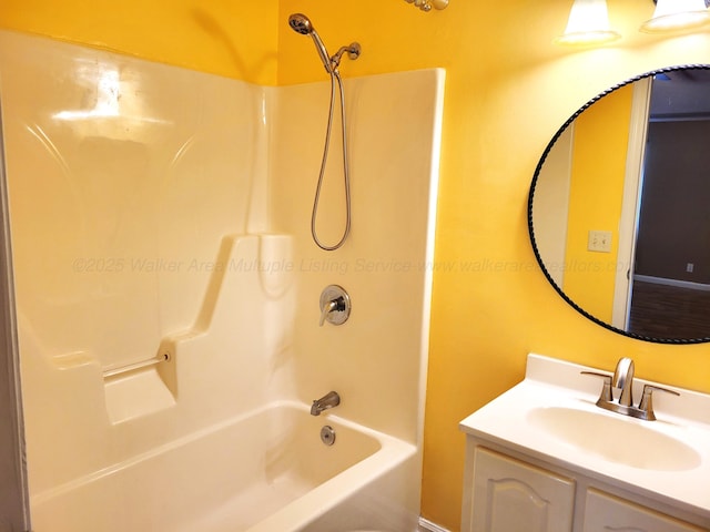 bathroom featuring vanity and shower / tub combination