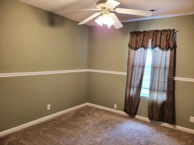 carpeted spare room featuring a ceiling fan, baseboards, and visible vents