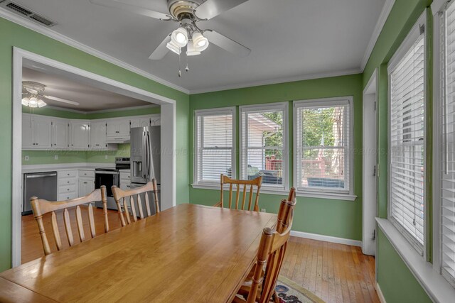 60 County Road 304, Cullman, AL 35057 - dining room featuring ceiling fan, light wood-type flooring, and crown molding