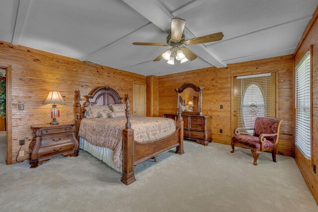 60 County Road 304, Cullman, AL 35057 - carpeted bedroom with wooden walls, beam ceiling, and a ceiling fan