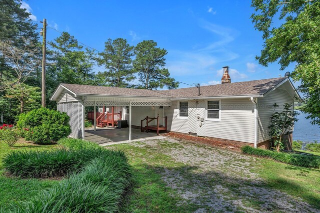 60 County Road 304, Cullman, AL 35057 - back of house featuring a chimney and roof with shingles