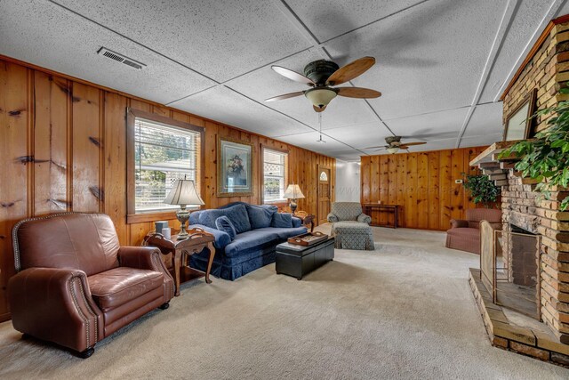 60 County Road 304, Cullman, AL 35057 - carpeted living room with ceiling fan, a fireplace, and wooden walls