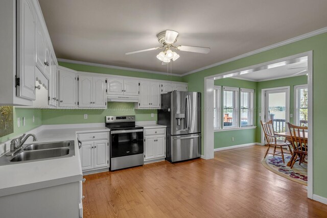 60 County Road 304, Cullman, AL 35057 - kitchen featuring appliances with stainless steel finishes, under cabinet range hood, a ceiling fan, light countertops, and white cabinets