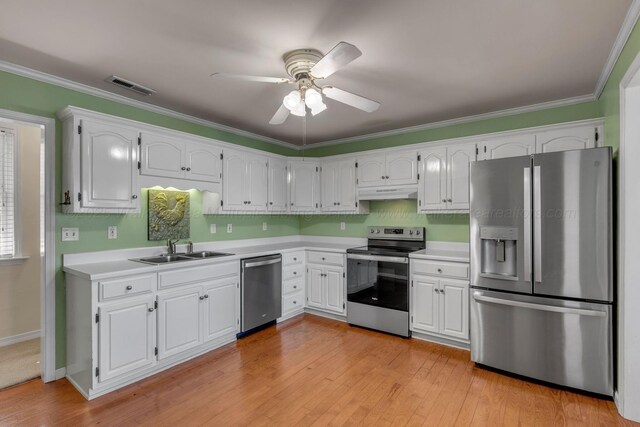 60 County Road 304, Cullman, AL 35057 - kitchen with appliances with stainless steel finishes, ceiling fan, light countertops, white cabinetry, and light wood-style floors