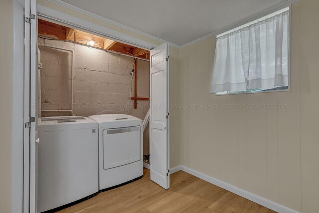 60 County Road 304, Cullman, AL 35057 - washroom with washing machine and clothes dryer, light wood-style flooring, and concrete block wall