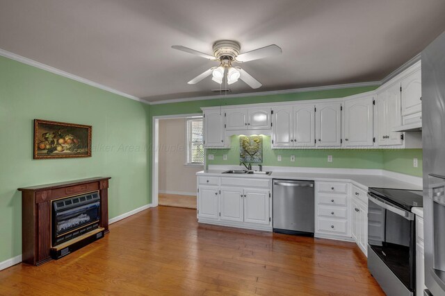 60 County Road 304, Cullman, AL 35057 - kitchen with stainless steel appliances, ceiling fan, ornamental molding, light countertops, and white cabinets