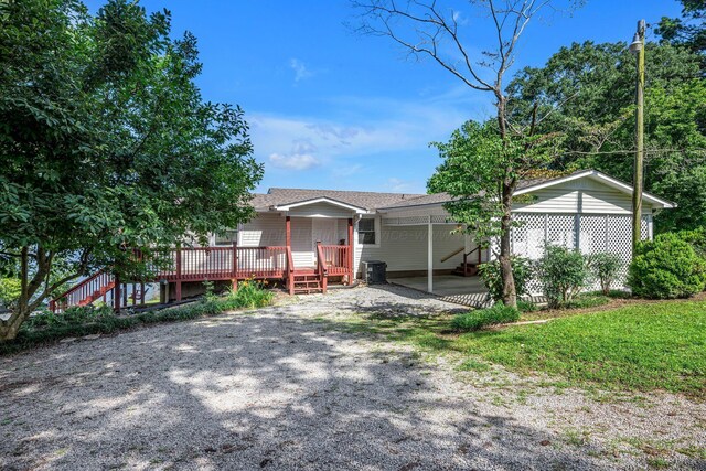 60 County Road 304, Cullman, AL 35057 - view of front facade with a deck and a shingled roof