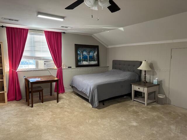 carpeted bedroom featuring cooling unit, lofted ceiling, visible vents, and a ceiling fan
