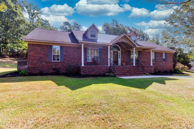 view of front of property featuring covered porch, crawl space, brick siding, and a front yard