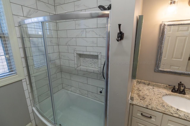 full bath with combined bath / shower with glass door and vanity