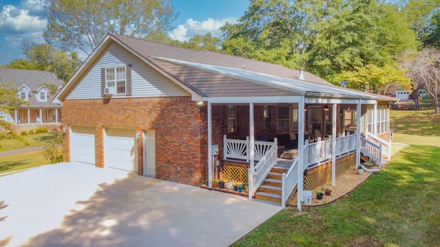 view of front of house with brick siding, a garage, concrete driveway, and a front yard