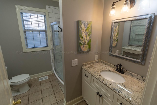 bathroom with visible vents, baseboards, a tile shower, toilet, and vanity