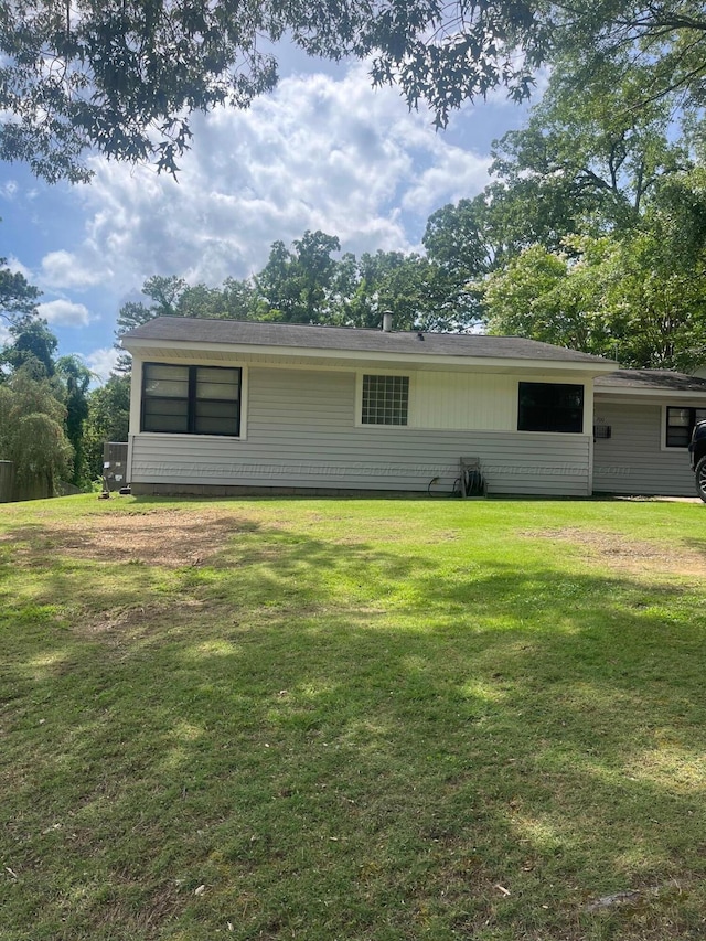 700 S 5th Ave, Jasper, AL 35501 - rear view of property with a yard