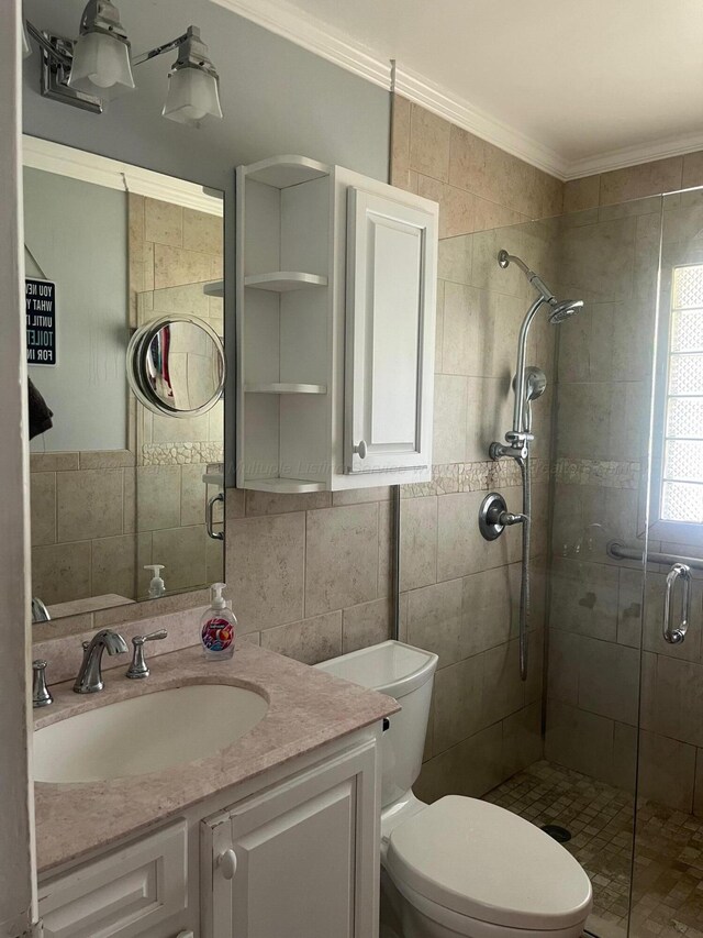 700 S 5th Ave, Jasper, AL 35501 - bathroom with ornamental molding, a stall shower, vanity, tile walls, and toilet