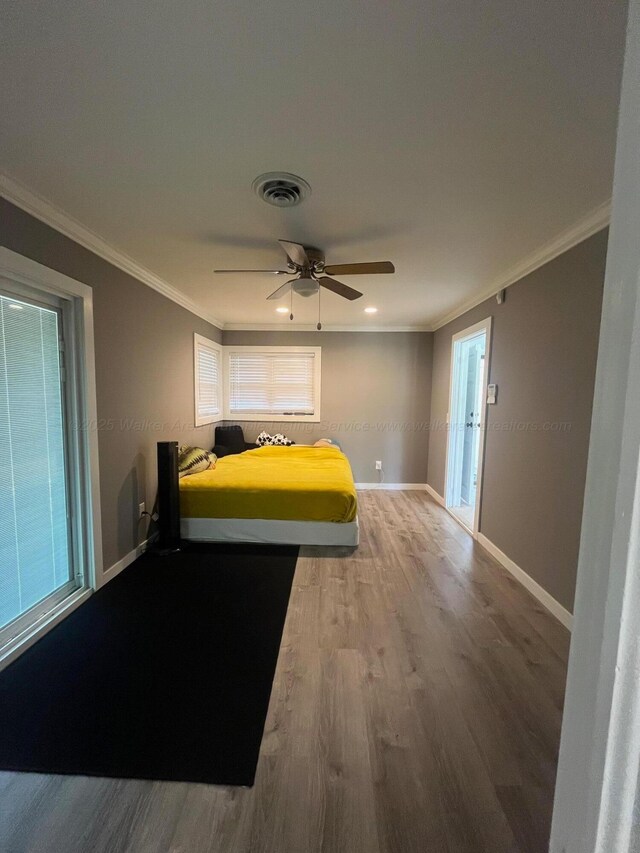 700 S 5th Ave, Jasper, AL 35501 - bedroom with wood finished floors, crown molding, baseboards, ceiling fan, and recessed lighting