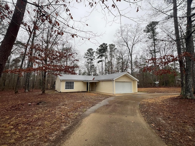 399 Arrowhead Rd, Jasper, AL 35504 - ranch-style home featuring metal roof, a garage, and concrete driveway