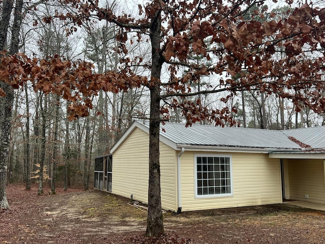 399 Arrowhead Rd, Jasper, AL 35504 - view of side of home featuring metal roof and an attached carport