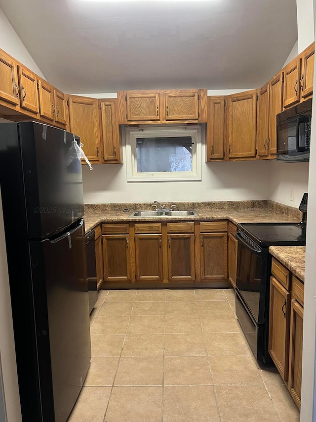 399 Arrowhead Rd, Jasper, AL 35504 - kitchen featuring light tile patterned flooring, a sink, black appliances, vaulted ceiling, and brown cabinetry