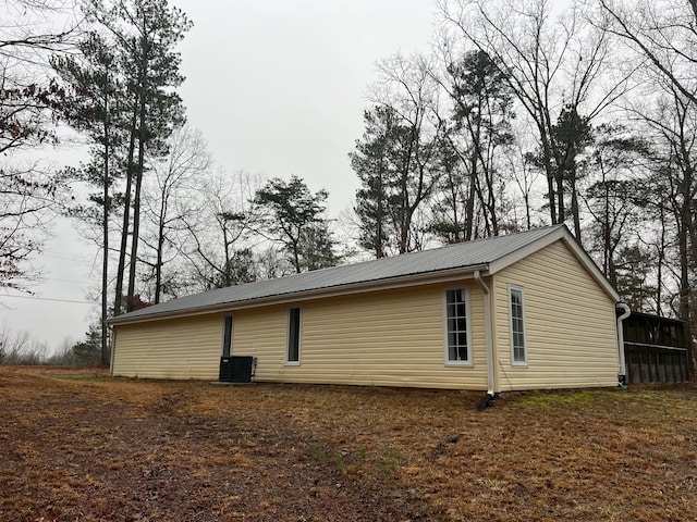 399 Arrowhead Rd, Jasper, AL 35504 - view of property exterior with central AC and metal roof