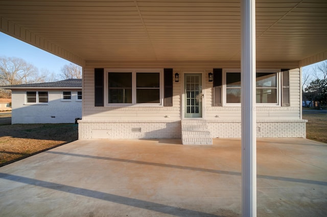 exterior space with an attached carport and crawl space