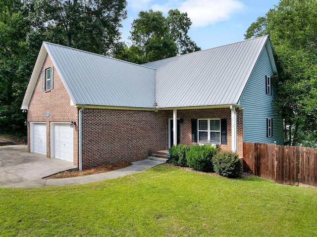 75 County Rd 881, Crane Hill, AL 35053 - view of front of home with brick siding, driveway, a metal roof, and an attached garage