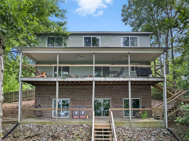 75 County Rd 881, Crane Hill, AL 35053 - back of house with stairs, brick siding, a balcony, and a deck