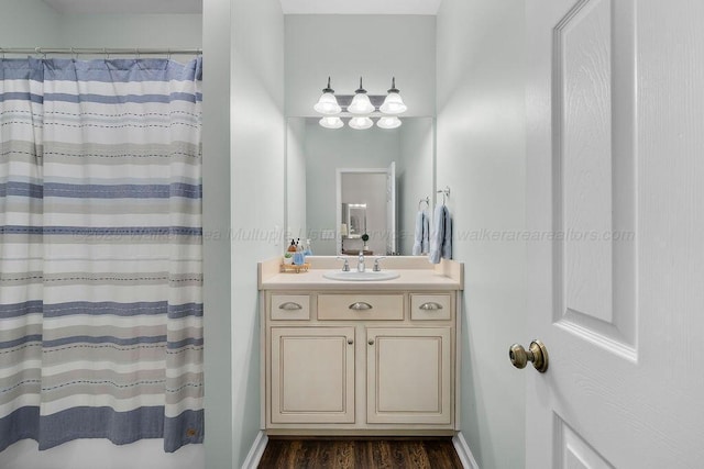 75 County Rd 881, Crane Hill, AL 35053 - bathroom featuring wood finished floors, vanity, and a shower with shower curtain