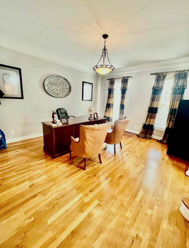 305 Chris Ln, Winfield, AL 35594 - dining room featuring baseboards, crown molding, and light wood-style flooring