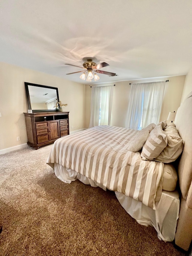 305 Chris Ln, Winfield, AL 35594 - bedroom with carpet floors, baseboards, and ceiling fan