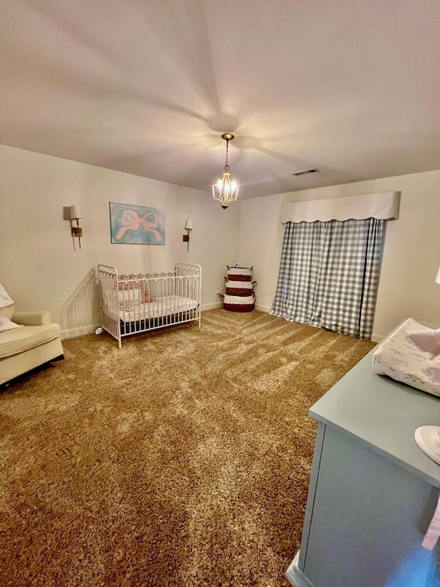 305 Chris Ln, Winfield, AL 35594 - bedroom featuring baseboards, visible vents, carpet, and an inviting chandelier